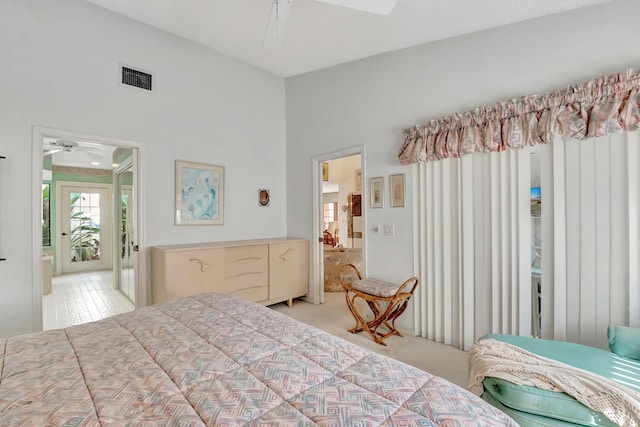 bedroom with light carpet and ceiling fan