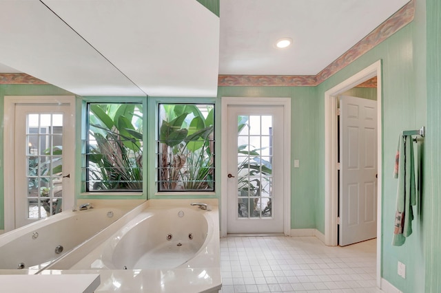 bathroom featuring tiled bath and tile patterned floors