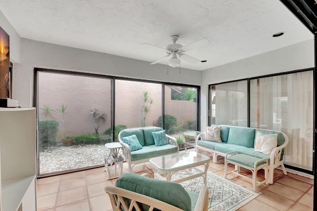 sunroom / solarium featuring ceiling fan