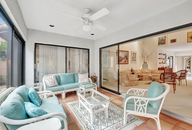 sunroom with ceiling fan