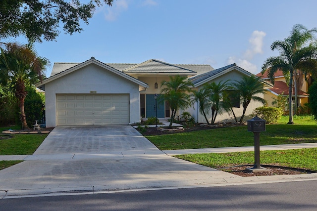 ranch-style house with a front yard and a garage