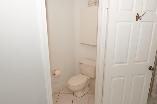 bathroom with tile patterned floors and toilet