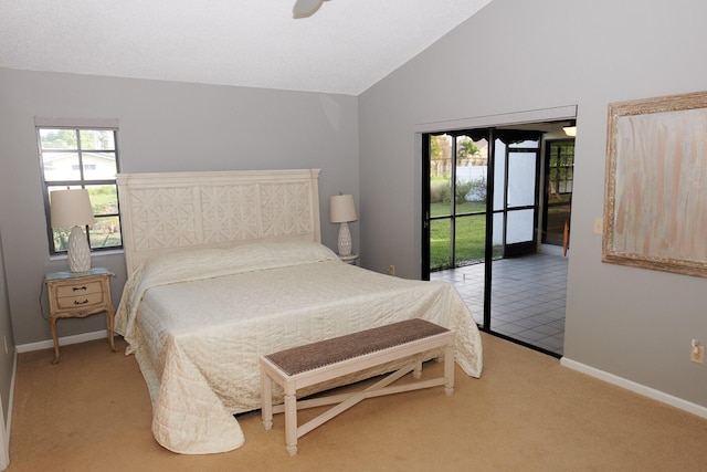 carpeted bedroom with access to exterior and lofted ceiling