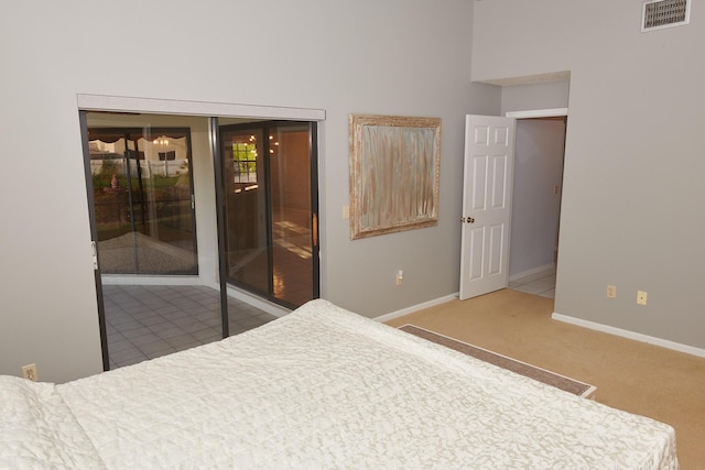 bedroom featuring access to exterior and carpet