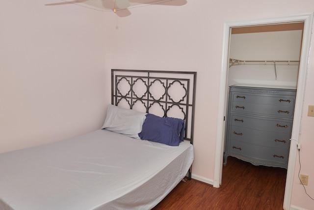 bedroom with a closet, ceiling fan, and dark hardwood / wood-style flooring