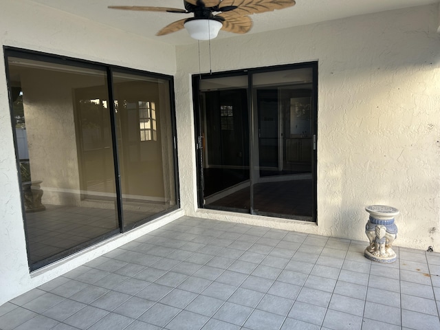 view of patio featuring ceiling fan