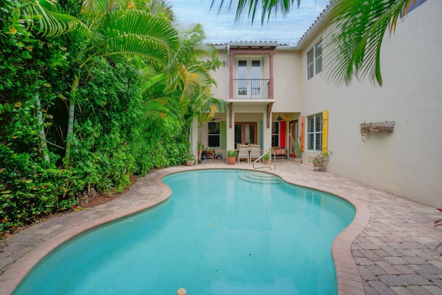 view of swimming pool with a patio area