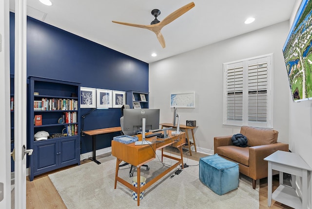 office area featuring light hardwood / wood-style floors, built in features, and ceiling fan