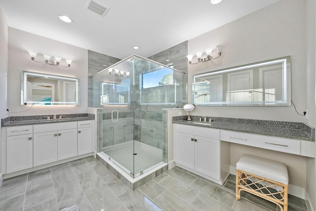 bathroom with vanity and walk in shower