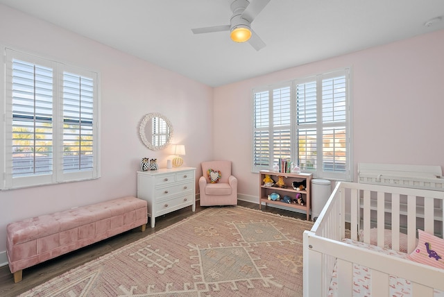 bedroom featuring hardwood / wood-style flooring and ceiling fan