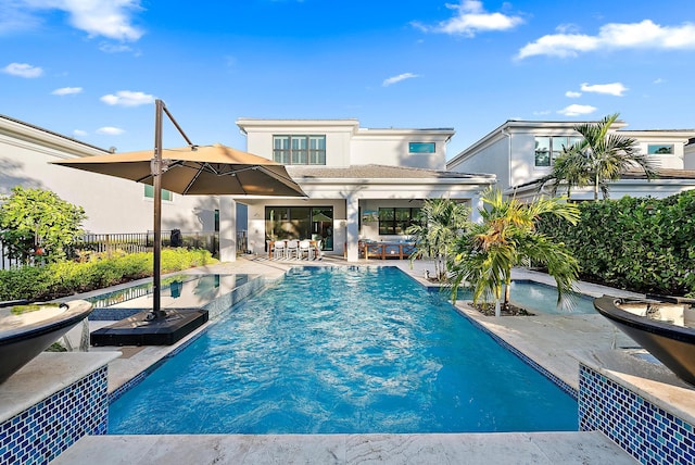 view of swimming pool featuring a patio area and pool water feature