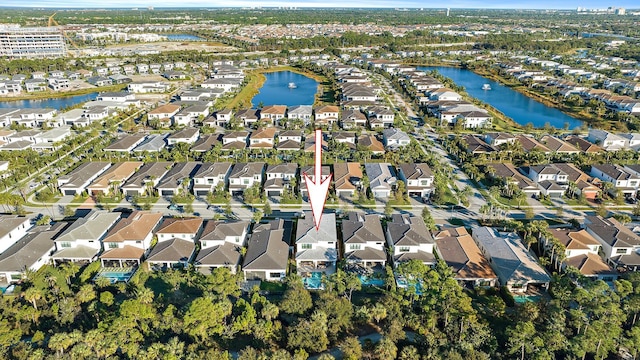 bird's eye view with a water view