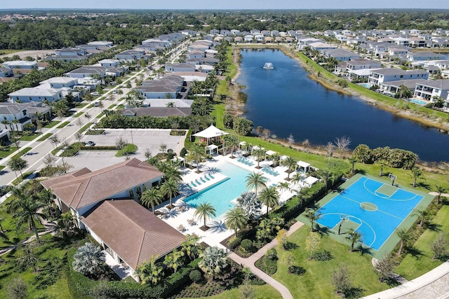 birds eye view of property with a water view