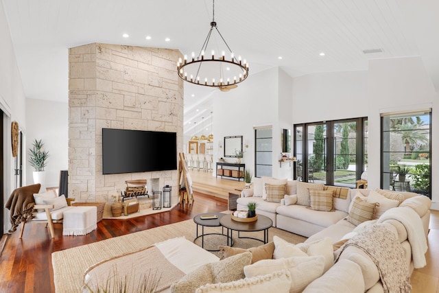 living room with hardwood / wood-style flooring, french doors, and a high ceiling