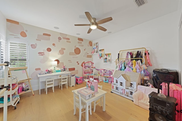 recreation room with hardwood / wood-style floors and ceiling fan