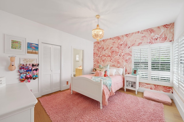 bedroom with an inviting chandelier, a closet, and ensuite bathroom