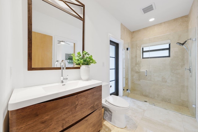 bathroom with vanity, an enclosed shower, and toilet