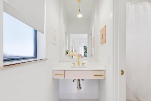 bathroom featuring sink and a wealth of natural light