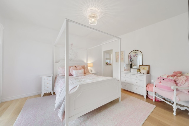 bedroom with light hardwood / wood-style floors