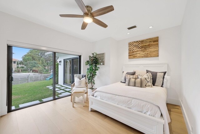 bedroom with access to outside, a closet, and light hardwood / wood-style floors