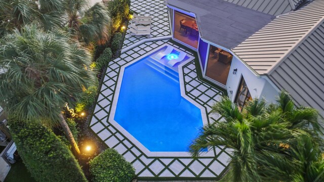 view of swimming pool featuring a patio area