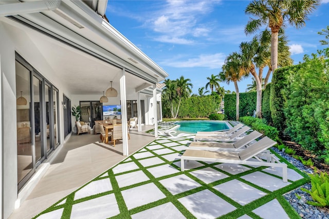 view of pool featuring a patio