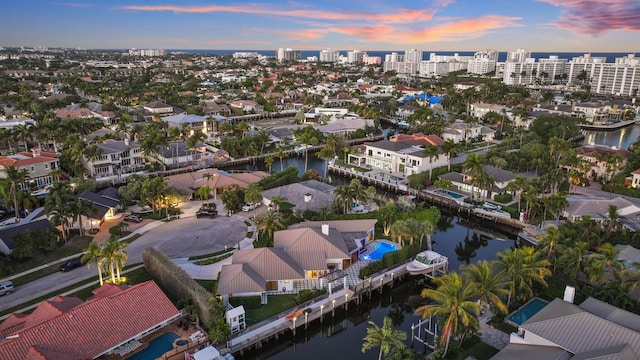 aerial view at dusk with a water view