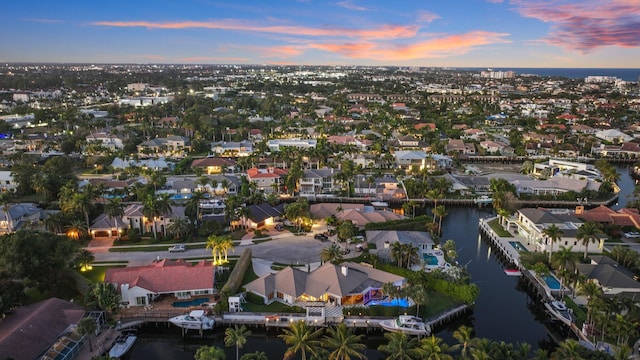 aerial view at dusk with a water view