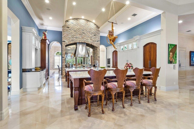 dining space featuring a high ceiling