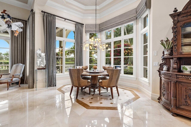 sunroom / solarium featuring plenty of natural light and a notable chandelier