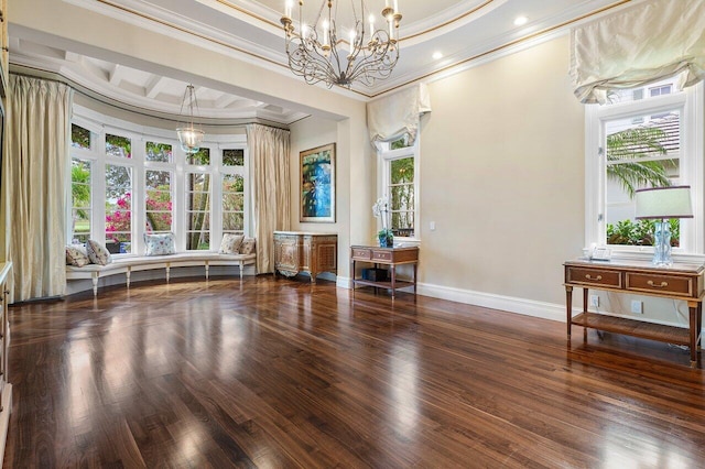 interior space with a notable chandelier, plenty of natural light, and ornamental molding