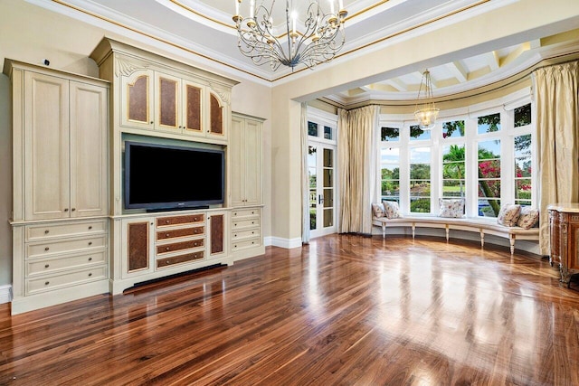 interior space featuring baseboards, ornamental molding, wood finished floors, and a notable chandelier