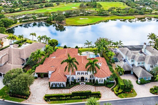 mediterranean / spanish-style house featuring a water view