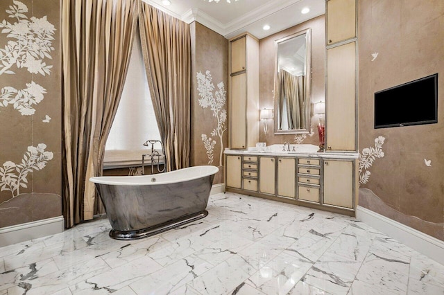 bathroom with a bathing tub, crown molding, and vanity