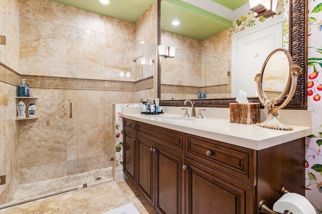 bathroom featuring a stall shower, recessed lighting, vanity, and tile walls