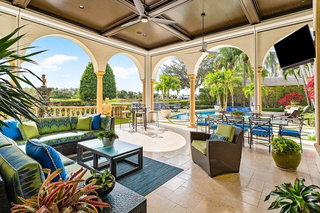 view of patio with a fenced in pool, outdoor dining area, outdoor lounge area, and ceiling fan