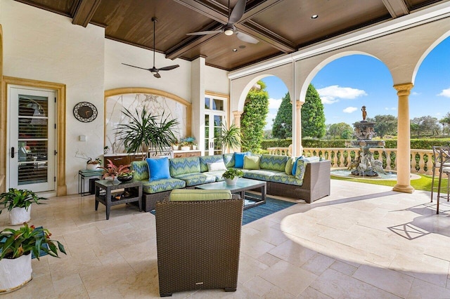 view of patio / terrace featuring ceiling fan and an outdoor living space