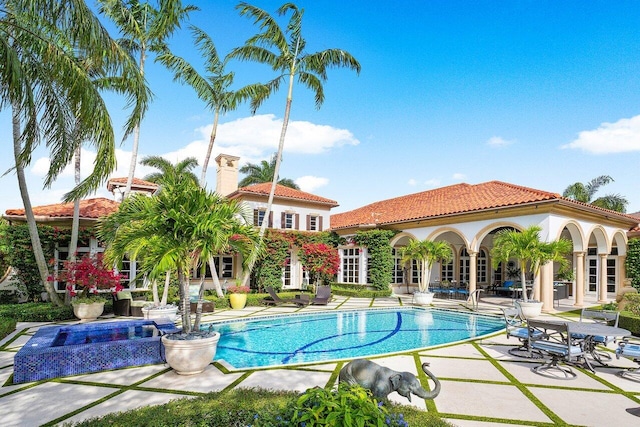 view of pool featuring a patio