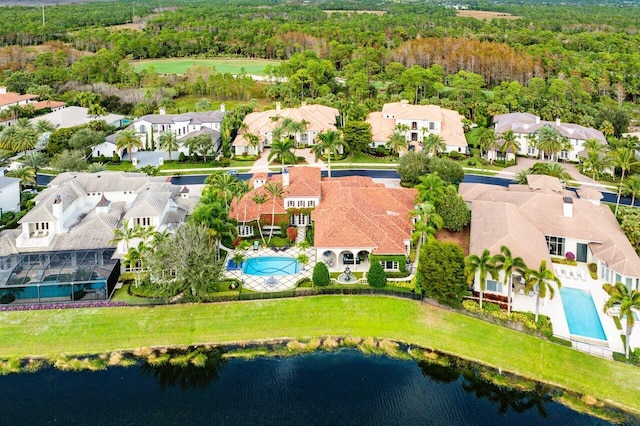 drone / aerial view featuring a water view and a residential view