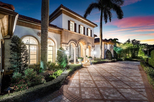 exterior space with a patio and stucco siding