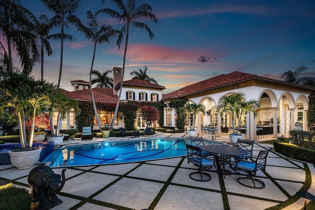 outdoor pool featuring a patio