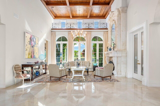 sitting room featuring french doors, wooden ceiling, and coffered ceiling