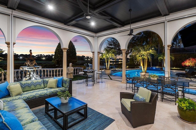 view of patio / terrace featuring a ceiling fan, an outdoor pool, and an outdoor hangout area