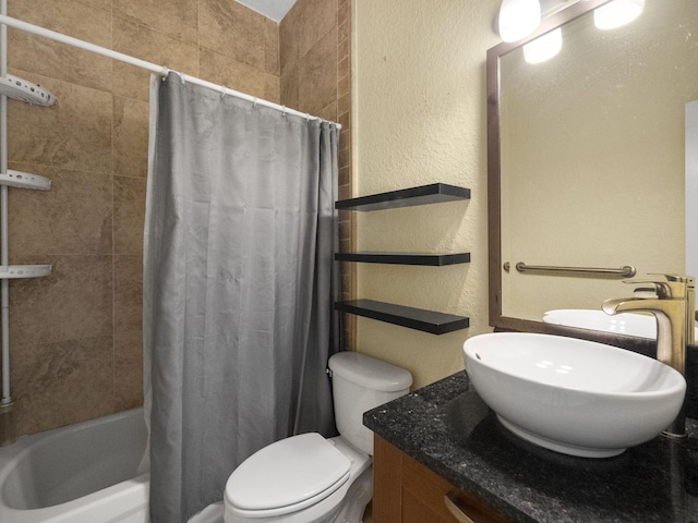 full bathroom with shower / tub combo, vanity, and toilet