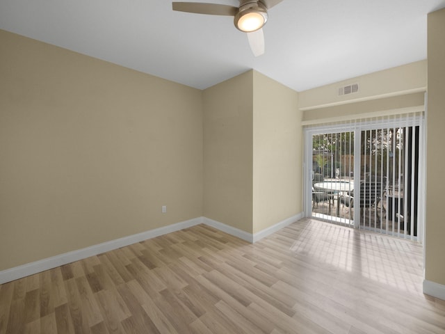 empty room featuring light wood-type flooring and ceiling fan