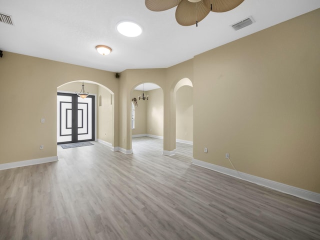 unfurnished room featuring ceiling fan and hardwood / wood-style flooring