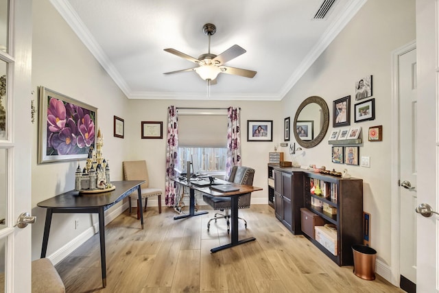 office space featuring ceiling fan, light wood-type flooring, and ornamental molding