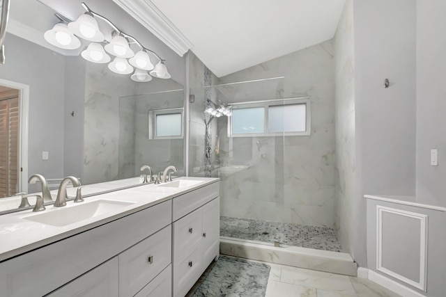 bathroom featuring vanity, lofted ceiling, and tiled shower