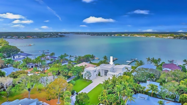 birds eye view of property with a water view