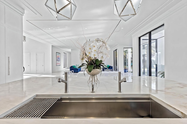 interior details with light stone counters and sink